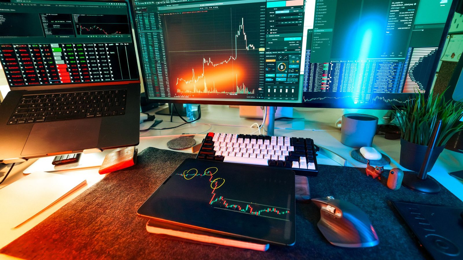 A trading desk with several screens showing crypto-asset charts and analysis tools.